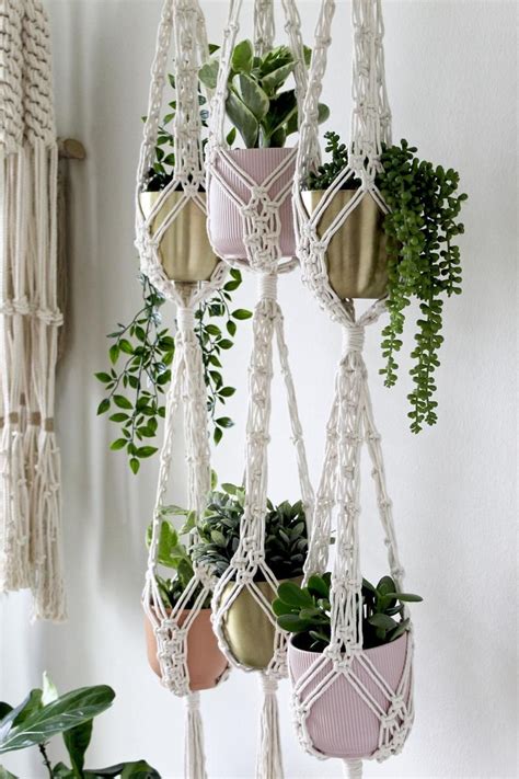 Measure six inches from the bottom of your final set of gathering knots, and tape the cords together at that spot. . Macrame plant hanger lowes